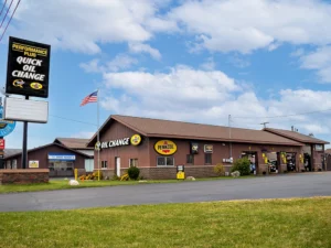 Oil change shop and tall pole sign with business logo
